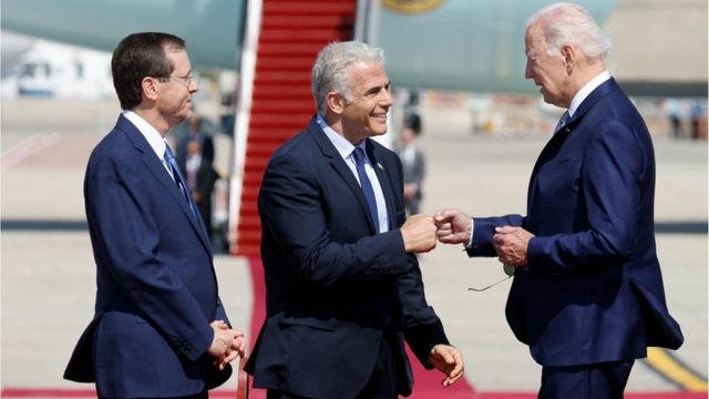 Biden greets the Saudi crown prince with a fist blow during a controversial visit