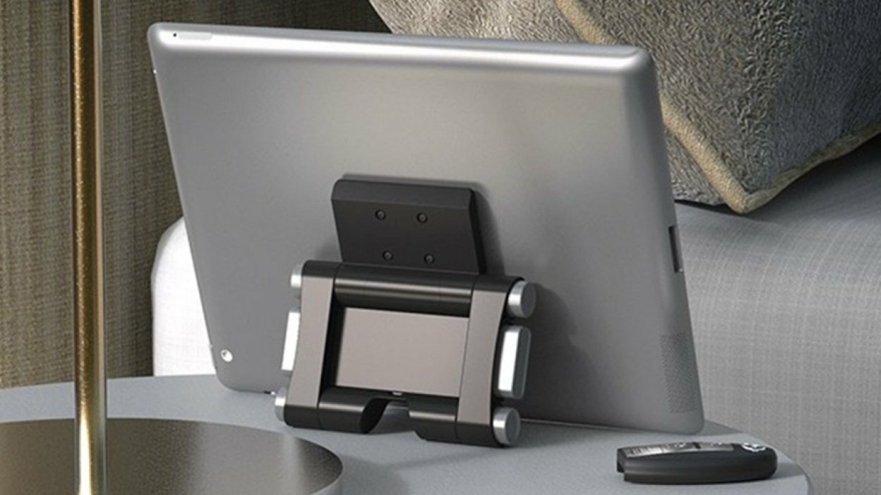 Stay connected while traveling with this adjustable phone and tablet mount